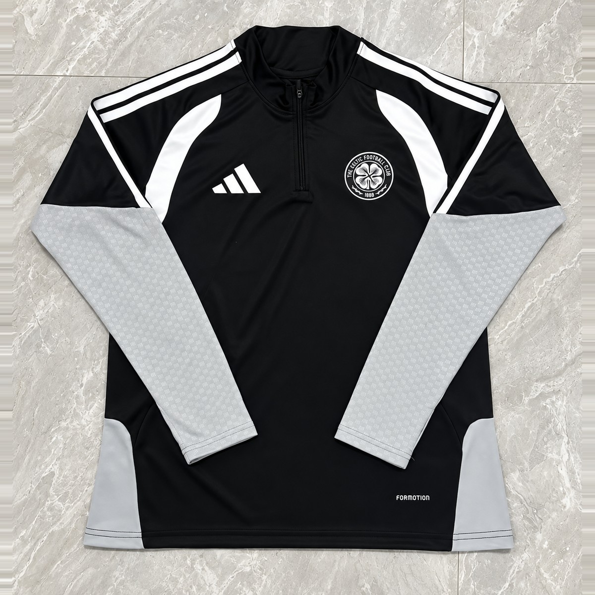 Celtic Black Quarter-Zip Training Top Black long-sleeve Celtic quarter-zip training top with light-grey sleeves