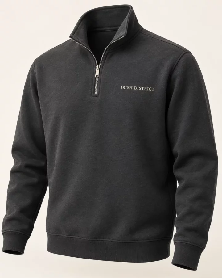 Charcoal District Quarter-Zip Sweatshirt design mock-up: Small IRISH DISTRICT left-chest lettering; silver-tone quarter zip
