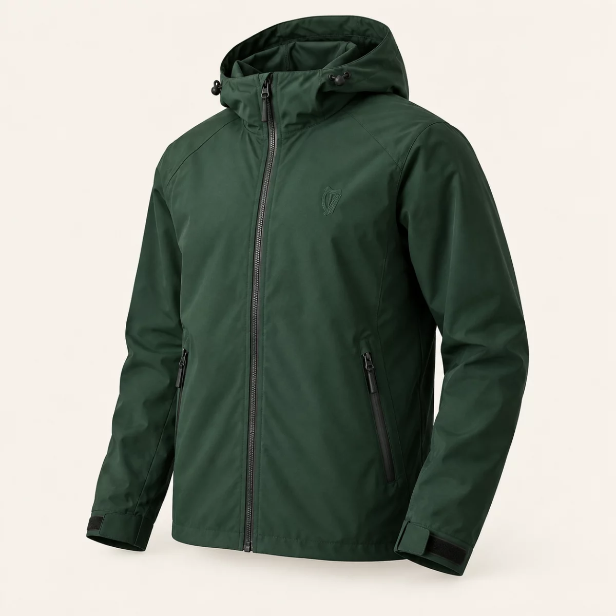 Atlantic Shell Jacket Forest green Atlantic Shell Jacket design mock-up: Small tonal harp chest emblem; hood; full zip; two zipped pockets