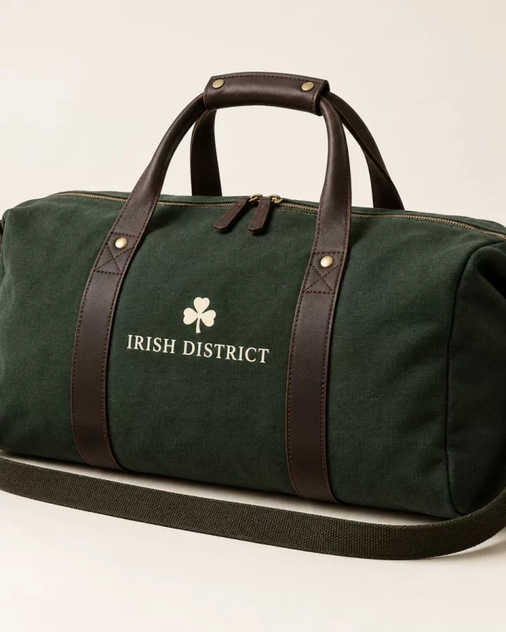 Forest green District Canvas Weekend Bag design mock-up: Forest-green canvas appearance; dark handles; cream IRISH DISTRICT wordmark