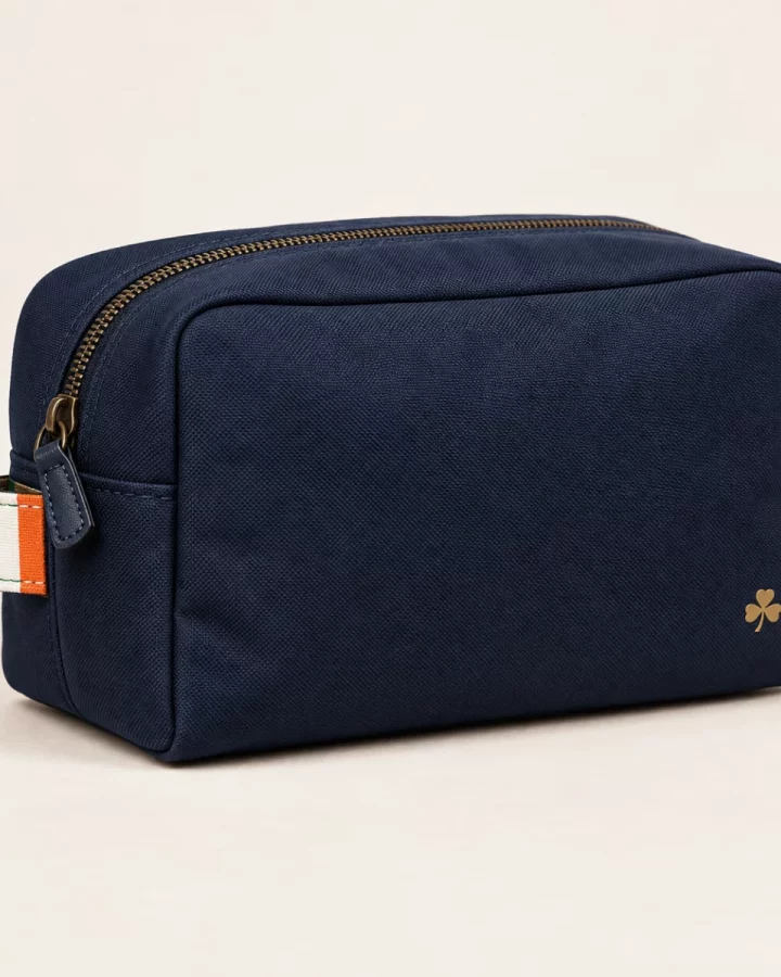 Navy Tricolour Travel Wash Bag design mock-up: Navy zip wash bag; narrow green white orange stitched-look tab