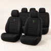 Black Heritage Car Seat Cover Set design mock-up: Black seat cover concept; small green harp; no vehicle compatibility claims