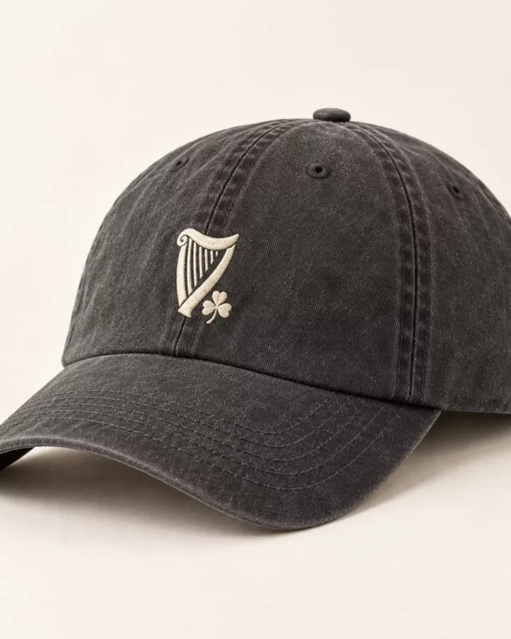 Washed charcoal Vintage Harp Cap design mock-up: Cream harp front; washed-charcoal cap; curved peak