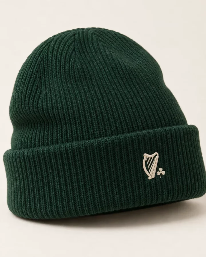 Forest green Heritage Cuffed Beanie design mock-up: Forest-green rib-knit appearance; cuff; small cream harp